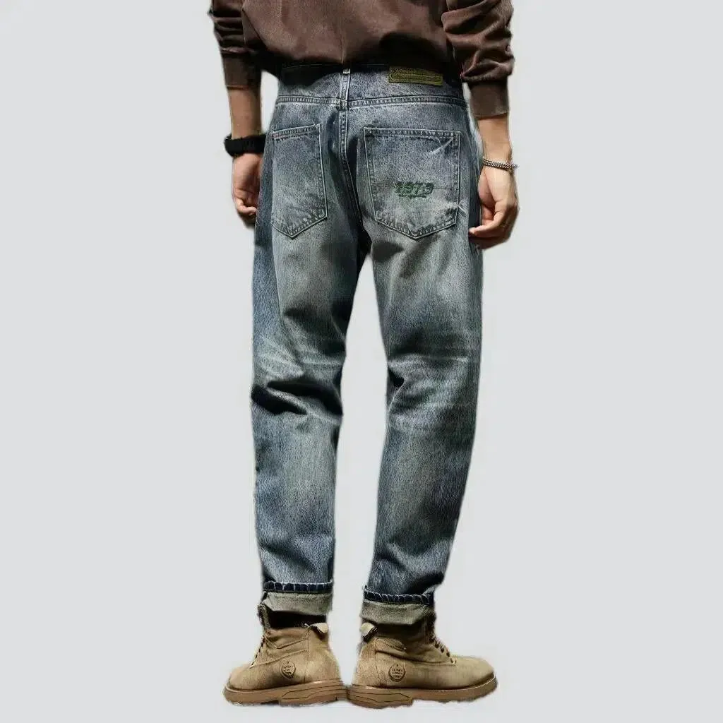 Whiskered men's loose jeans